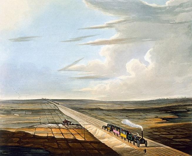 This is the full image of the section above. A railway line runs diagonally across the image and a steam locomotive pulling three coaches heads to the bottom right. Another steam train can be seen in the far distance. A patchwork of flat fields lie either side of the track, with a small station building on the left with a red roof. A blue sky rises above the scene.