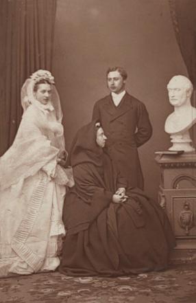 Queen Victoria, Prince Edward and Princess Alexandra photographed with a bust of Prince Albert soon after the Royal Wedding in 1863 by John Jabez Edwin Mayall (carbon print, courtesy of the National Portrait Gallery, London NPG x36269)