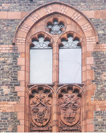 Sculpture on the exterior of the Victoria Building - The Victoria University Coat of Arms representing the three northern colleges (left crest) and the University of Liverpool crest on the right.