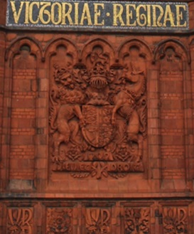 Left - The Jubilee Clock Tower displaying part of the Jubilee Inscription alongside the Royal Coat of Arms.