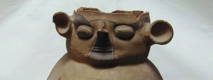 Chancay Funeral Offering in the form of an anthropomorphic figure supported in a bowl stand.