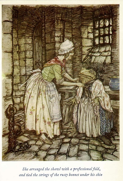 Mr Toad is being dressed in women’s clothing. He wears a blue spotted dress with apron and shawl over it. A taller, young woman puts a black bonnet on him. She is wearing a floral skirt, apron and red neckerchief with a white mob cap. 