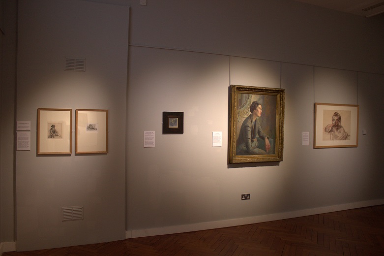 far left: Portrait of Elisabeth Vellacott by Evelyn Gibbs/2nd left: Self Portrait by Elisabeth Gibbs/large painting 2nd right: Self-portrait by Marjorie Brooks [label below]/far right: portrait of a young woman by Sam Marshall.  