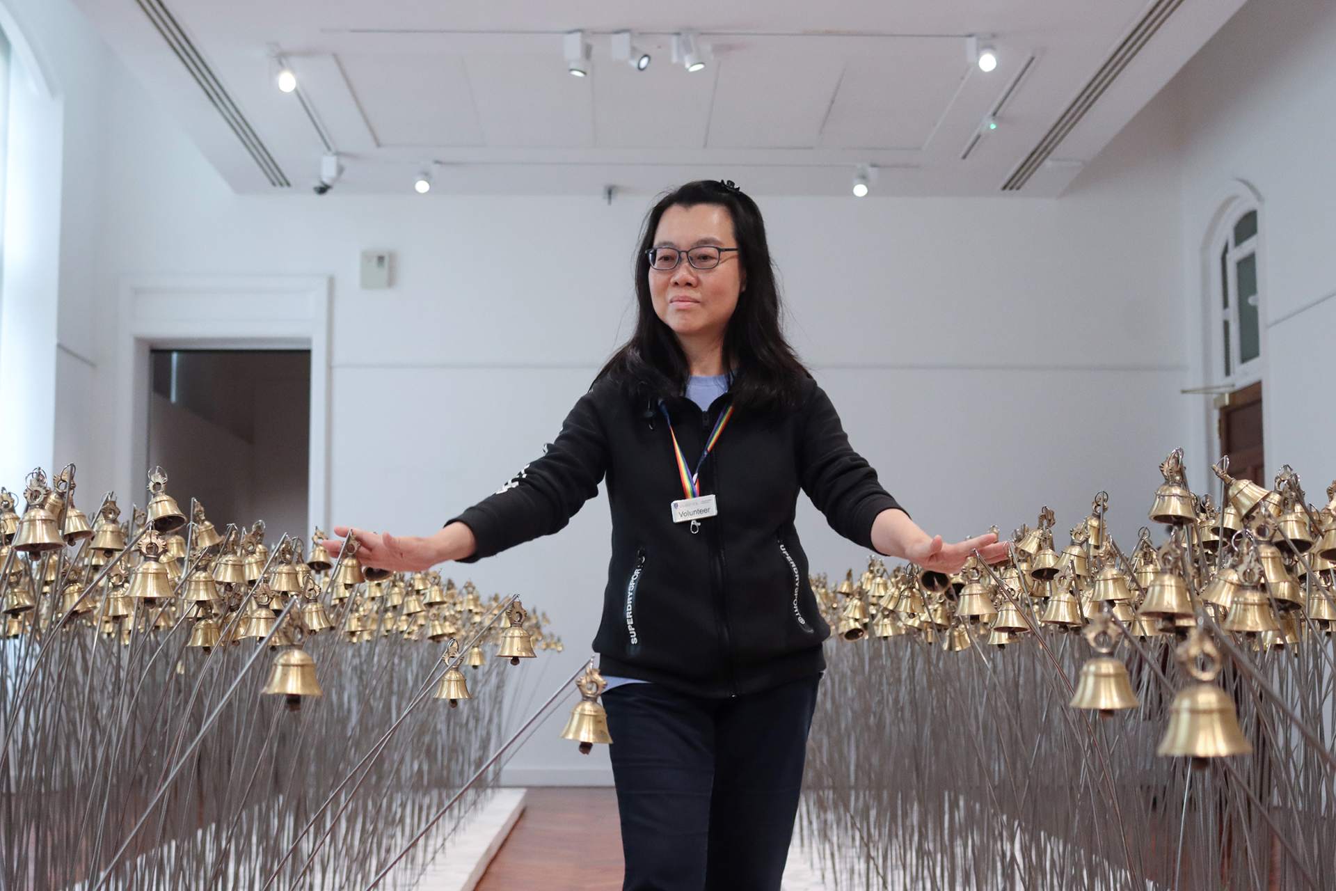 A volunteer walks through an art installation at the VG&M