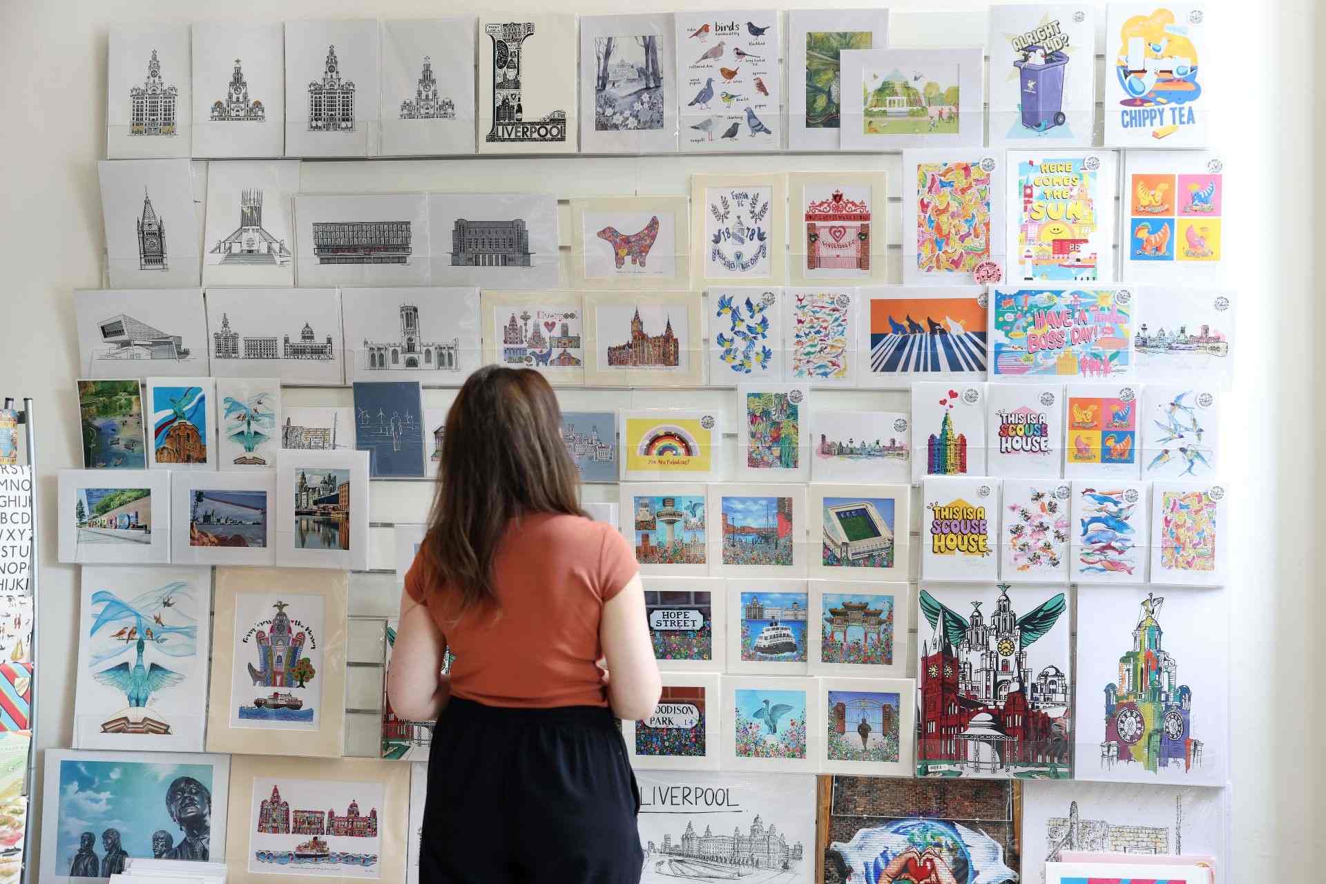 A customer browses artwork in the VG&M gift shop