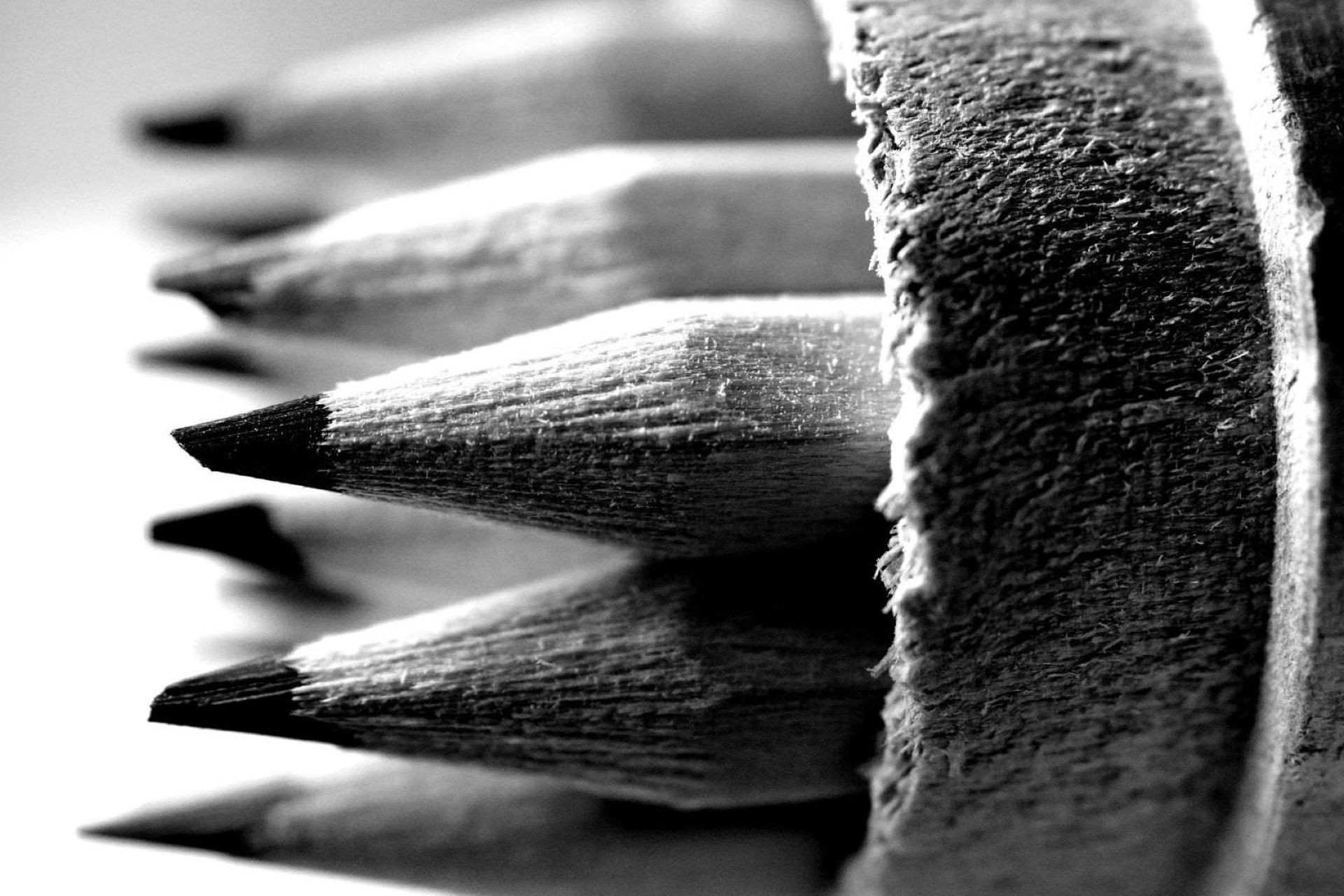 A close-up of drawing pencils in black and white